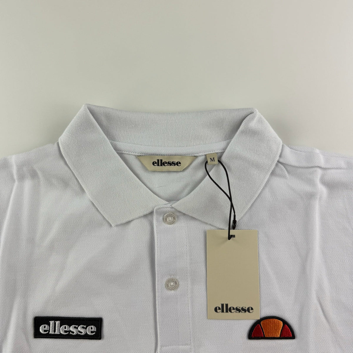 Ellesse Muccia Polo | Weiß / Schwarz (S-XXL)