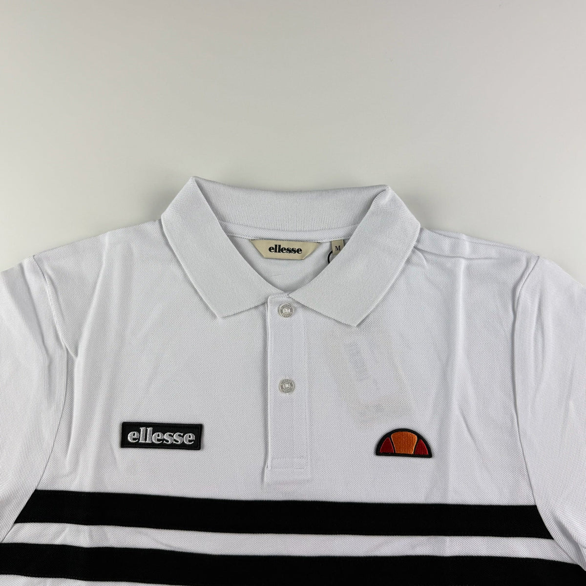 Ellesse Muccia Polo | Weiß / Schwarz (S-XXL)